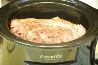 Chuck roast atop vegetables in crockpot